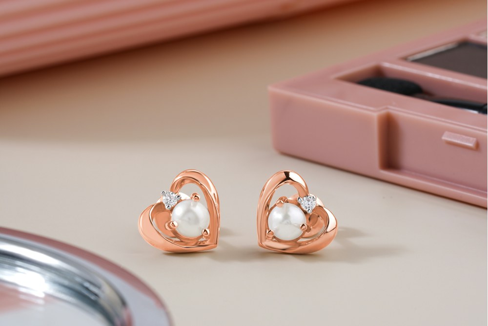 Decorative earrings with pearl-style details