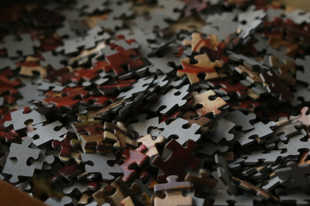 A pile of scattered puzzle pieces; illustrative stock photograph