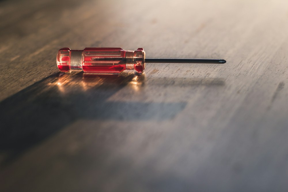 red and silver screw driver; illustrative stock photograph