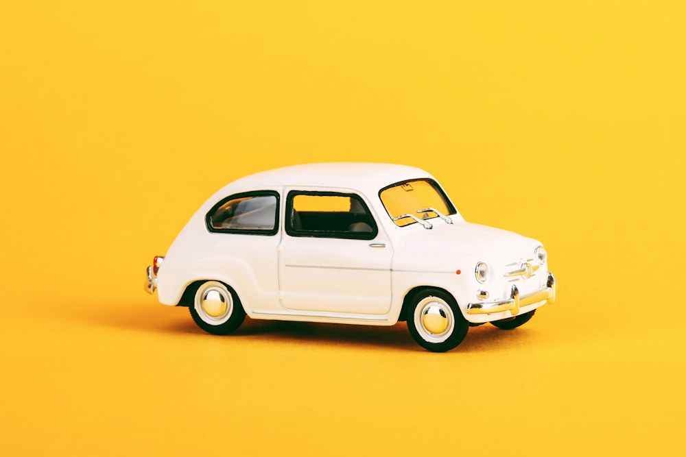 white volkswagen beetle coupe scale model; illustrative stock photograph